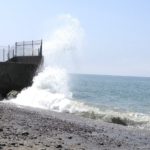 Waves hitting a cement wall